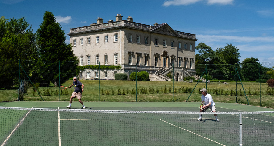 Playing tennis in the grounds at Kirtlington Park