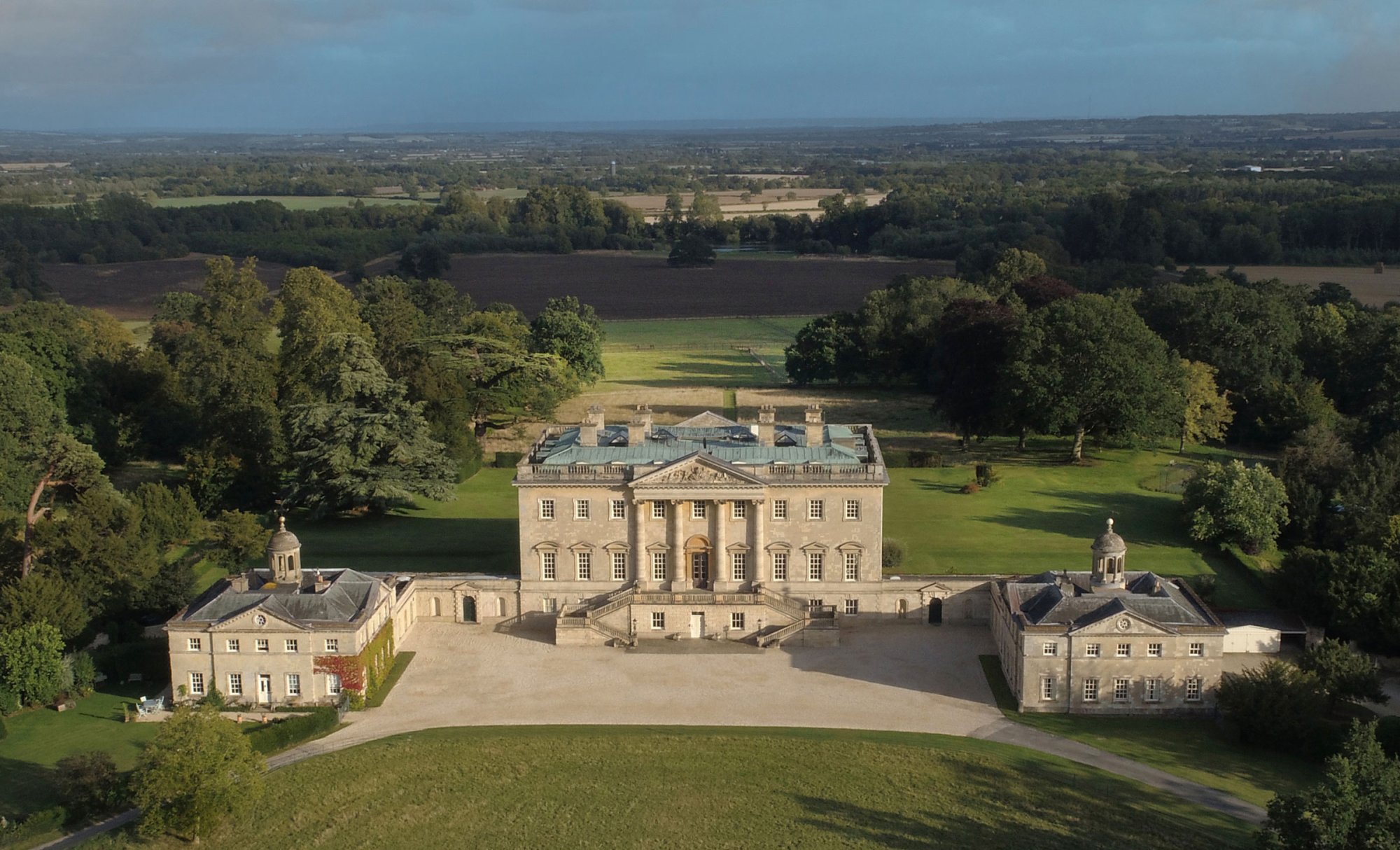 Aerial photograph of Kirtlington Park, an 18th Century Palladian house in Oxfordshire which can be hired for corporate events, private stays, celebrations and weddings